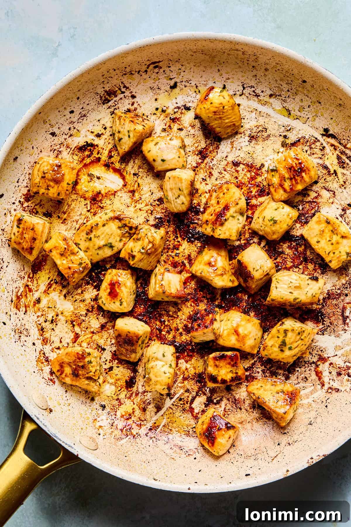 chicken pieces in a skillet