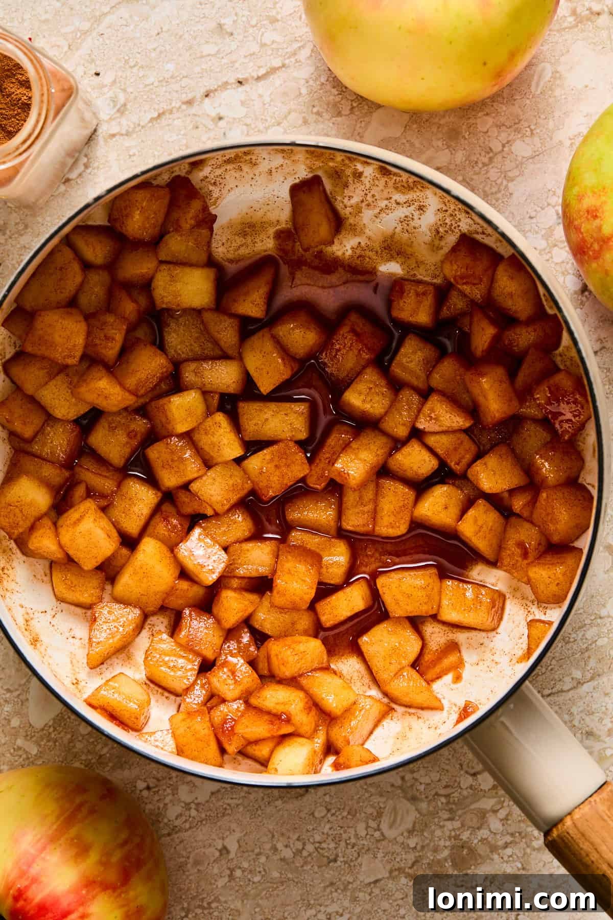 Apple Pie Protein Overnight Oats 4 caramelized apples in a pot