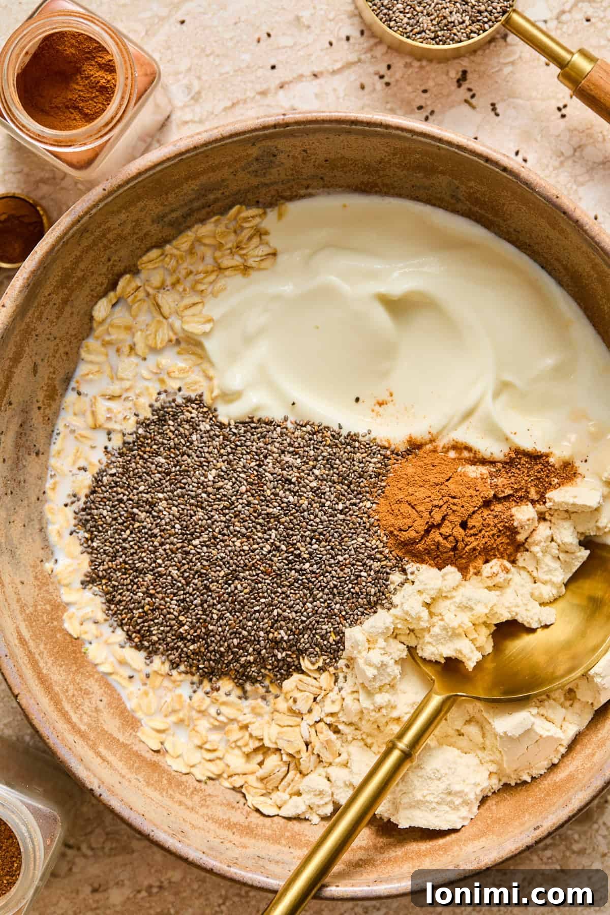 Apple Pie Protein Overnight Oats 5 ingredients for apple pie overnight oats in a bowl